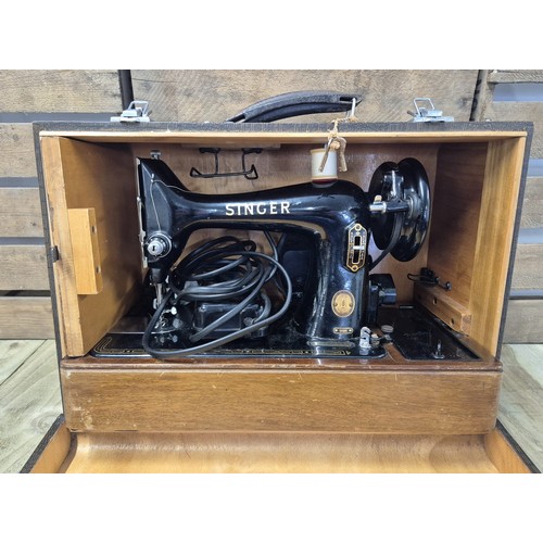 432 - Cased electric 99K Singer sewing machine.