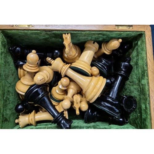 408 - Antique light oak box containing turned chess pieces. [10.5cm high- tallest piece]