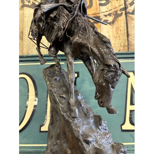 406 - After Frederic Remington 
Limited edition 24/100 patinated bronze on green marble plinth titled 