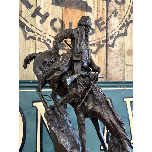 406 - After Frederic Remington 
Limited edition 24/100 patinated bronze on green marble plinth titled 