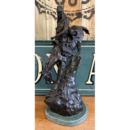 406 - After Frederic Remington 
Limited edition 24/100 patinated bronze on green marble plinth titled 