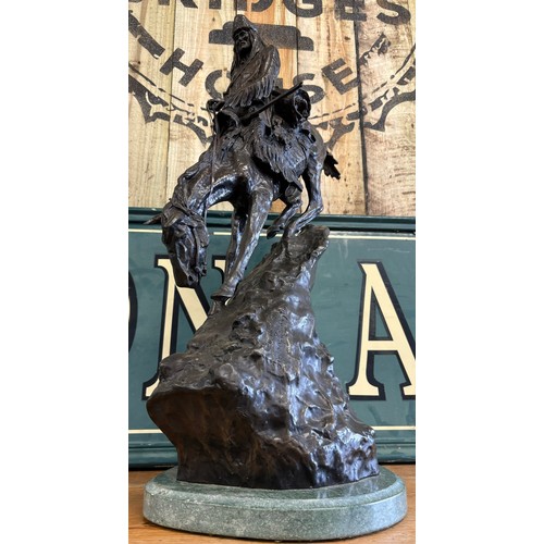 406 - After Frederic Remington 
Limited edition 24/100 patinated bronze on green marble plinth titled 