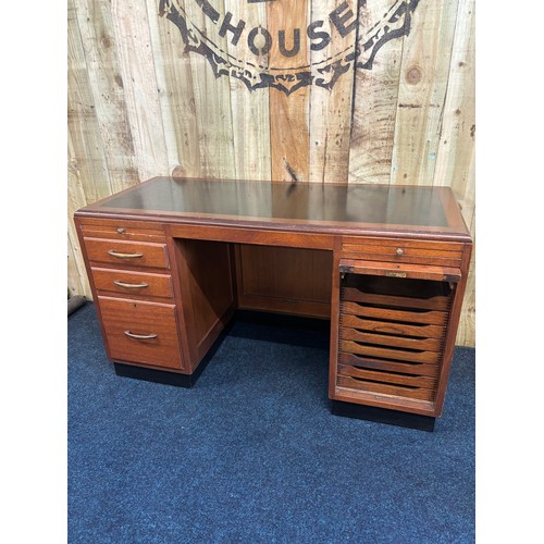 349 - 1909 Bankers/ Partners desk. Solid mahogany with composite top. Lift up side door revealing eight na... 