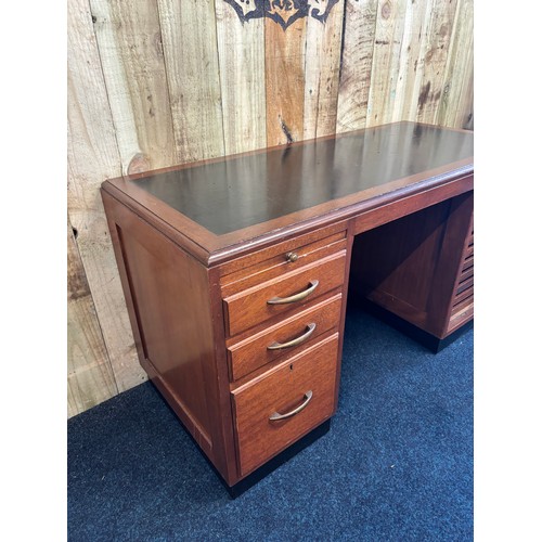 349 - 1909 Bankers/ Partners desk. Solid mahogany with composite top. Lift up side door revealing eight na... 