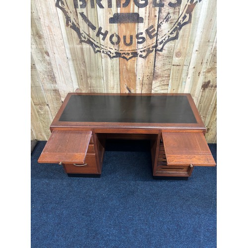 349 - 1909 Bankers/ Partners desk. Solid mahogany with composite top. Lift up side door revealing eight na... 