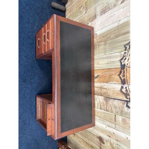 349 - 1909 Bankers/ Partners desk. Solid mahogany with composite top. Lift up side door revealing eight na... 