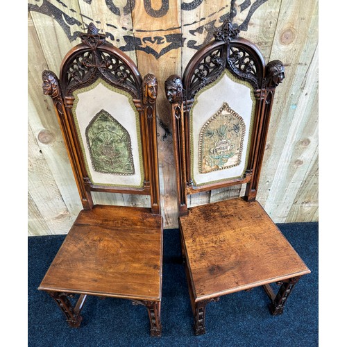 341 - A Pair of Gothic style fruit wood chairs with original tapestry panels. These solid Victorian chairs... 