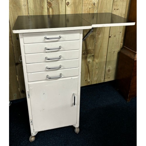 336 - Vintage dentist cabinet; flip top work station top, Five narrow drawers leading to door and storage ... 