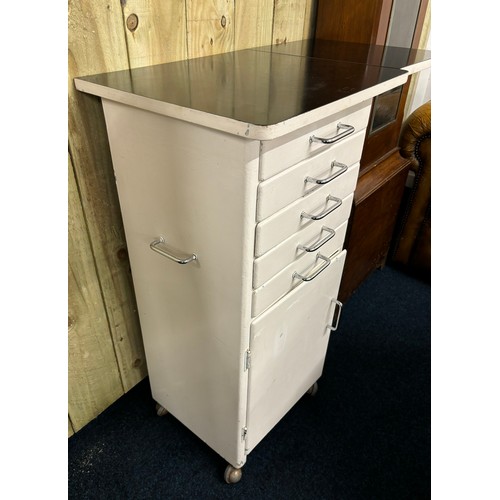 336 - Vintage dentist cabinet; flip top work station top, Five narrow drawers leading to door and storage ... 