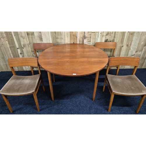 315 - Mid century Beatility dining table of round form with four matching chairs.