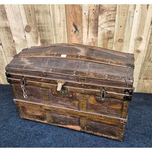 311 - 19th century dome top trunk; leather and wooden panelled, Leather handles to the side. Ball bearing ... 