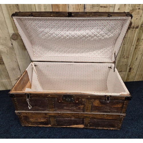 311 - 19th century dome top trunk; leather and wooden panelled, Leather handles to the side. Ball bearing ... 