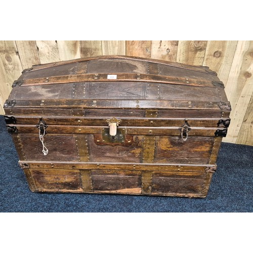 311 - 19th century dome top trunk; leather and wooden panelled, Leather handles to the side. Ball bearing ... 