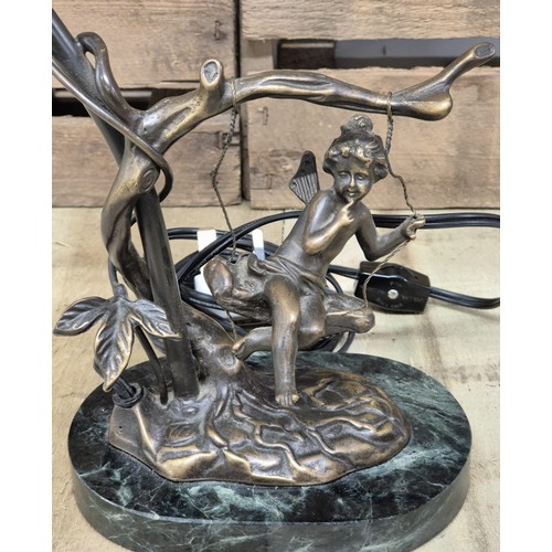 165 - Bronze table lamp sculpture, child on a swing. Raised on a marble base.