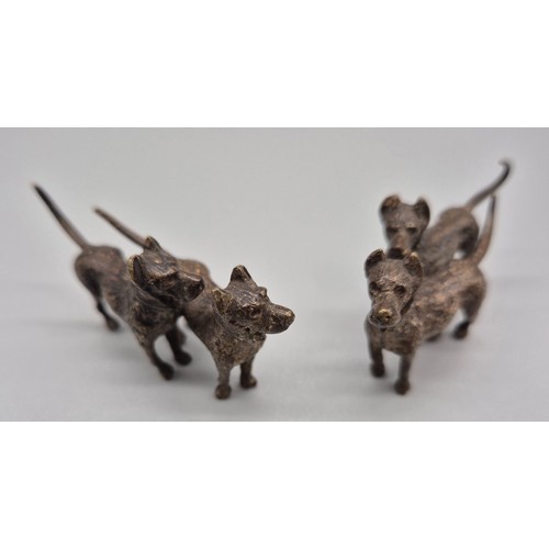 147 - A Pair of Cold painted Bronze dog sculptures. [6cm in length]