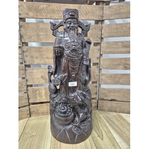 221 - Large and heavy Chinese hardwood carving of an emperor. [59cm high]