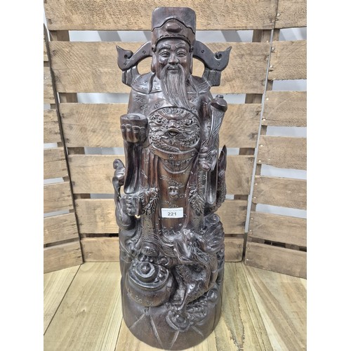 221 - Large and heavy Chinese hardwood carving of an emperor. [59cm high]