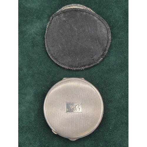 66 - Birmingham silver ladies compact with protective sleeve. [6.3cm diameter]