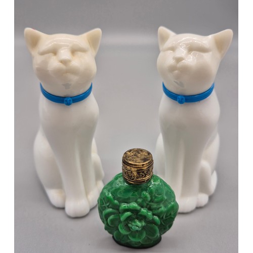 101 - A Lot of three vintage perfume bottles; Czech malachite glass perfume bottle and two cat shaped Avon... 