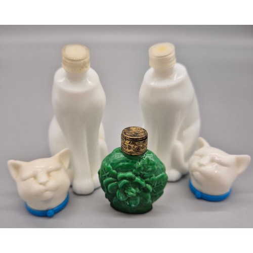 101 - A Lot of three vintage perfume bottles; Czech malachite glass perfume bottle and two cat shaped Avon... 