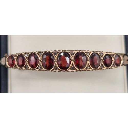 122 - Antique Chester 9ct rose gold bracelet fitted with nine various sized Garnet gem stones. [8.09grams]... 