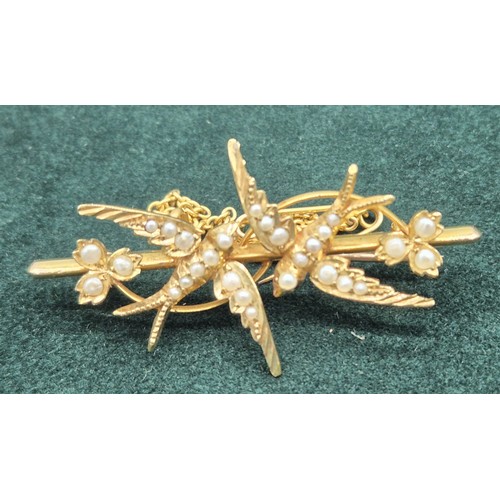 130 - Edwardian 15ct yellow gold bar brooch designed with two swallows and fitted with seed pearls. Comes ... 