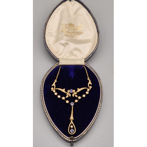 132 - Antique 15ct yellow gold ornate pendant with attached necklace. Fitted with seed pearls and three ro... 