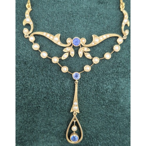 132 - Antique 15ct yellow gold ornate pendant with attached necklace. Fitted with seed pearls and three ro... 