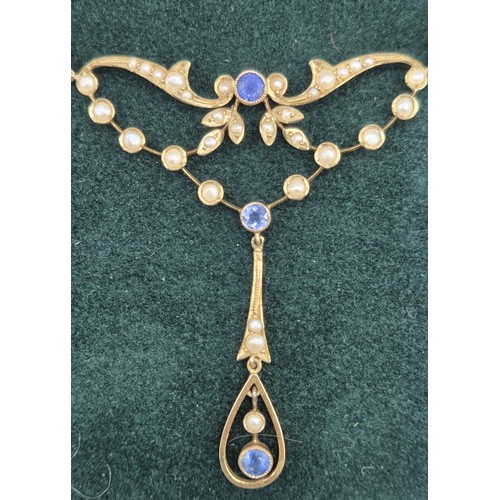 132 - Antique 15ct yellow gold ornate pendant with attached necklace. Fitted with seed pearls and three ro... 