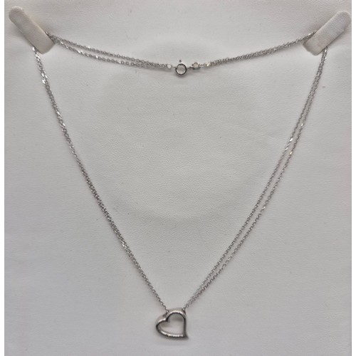 135 - 9ct white gold heart shaped pendant and chain. [4.14grams]