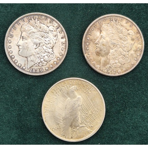 140 - Three American Silver one dollar coins; 1886 Liberty one dollar coin, 1891 Liberty one dollar coin a... 