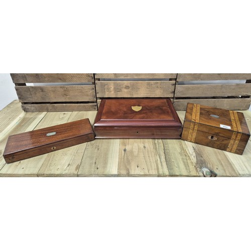 204 - Three various sized antique boxes; Mahogany cutlery chest with brass cartouche, Mahogany instrument ... 