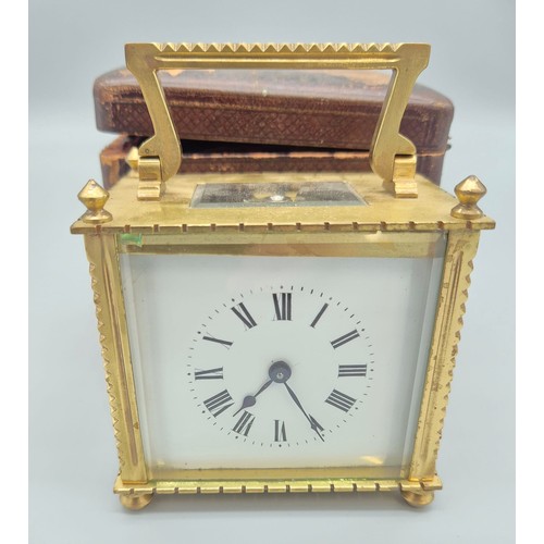 148 - Antique single drum brass and bevel glass carriage clock with travel case. [8.5x8.5x6cm]