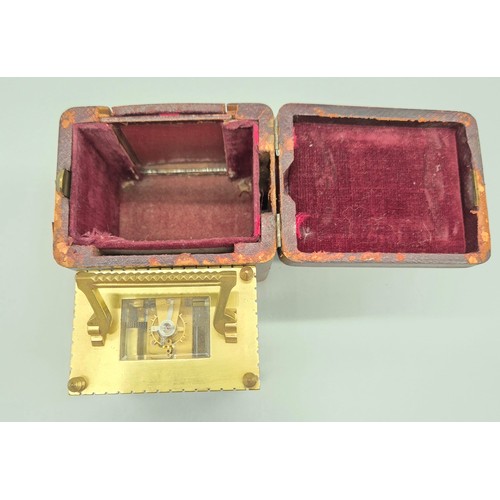 148 - Antique single drum brass and bevel glass carriage clock with travel case. [8.5x8.5x6cm]