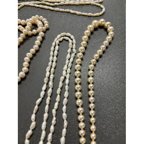 87 - Tray of fresh water pearl necklaces; Ciro 9ct gold clasp and catch and faux pearls necklace, Large s... 