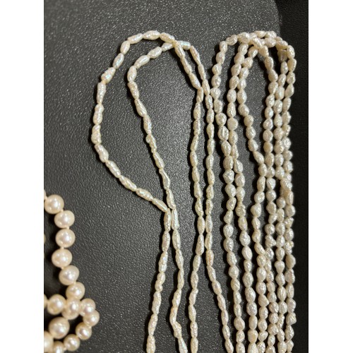 87 - Tray of fresh water pearl necklaces; Ciro 9ct gold clasp and catch and faux pearls necklace, Large s... 