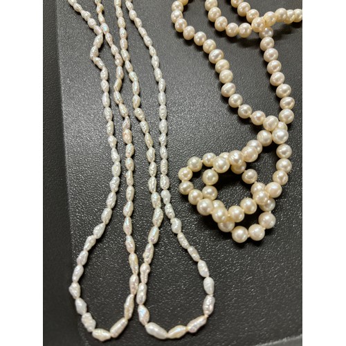 87 - Tray of fresh water pearl necklaces; Ciro 9ct gold clasp and catch and faux pearls necklace, Large s... 