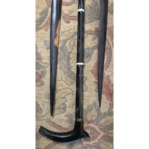 215A - Antique horn walking stick and two African wooden carved spears. [93cm length]