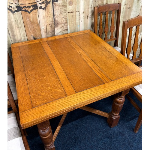 462 - Antique Oak pull out dining table, together with four matching chairs. Square top section with pull ... 