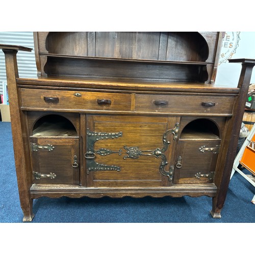 466 - Late 19th century arts and crafts inspired oak dresser. Two door section and shelved area top, Recta... 