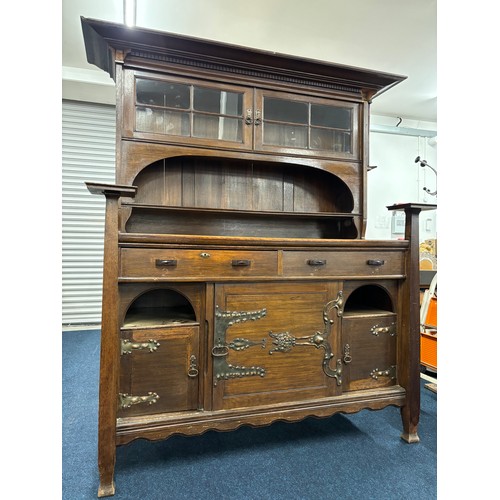 466 - Late 19th century arts and crafts inspired oak dresser. Two door section and shelved area top, Recta... 