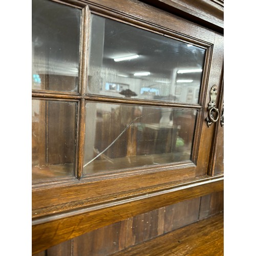 466 - Late 19th century arts and crafts inspired oak dresser. Two door section and shelved area top, Recta... 