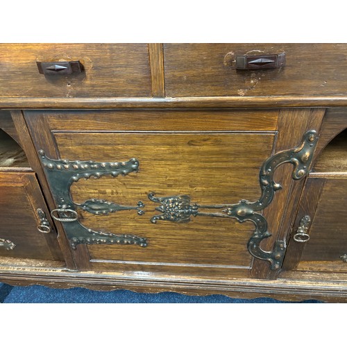 466 - Late 19th century arts and crafts inspired oak dresser. Two door section and shelved area top, Recta... 