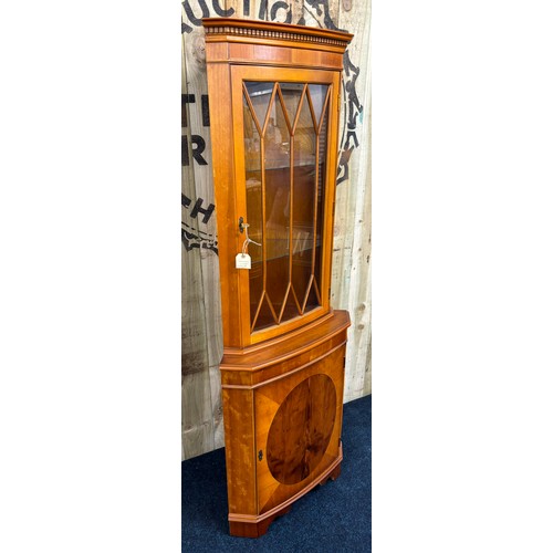 469 - Yew wood corner cabinet. [182x66cm]