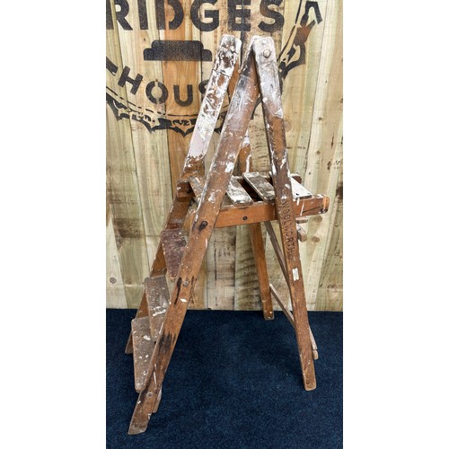 474 - Antique/ vintage wooden folding ladders for Woolworths. [140cm high]