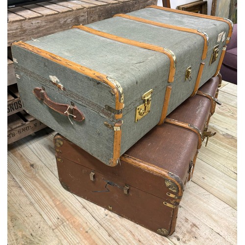 485 - Two vintage steamer trunks; fitted with wooden and metal bounds.