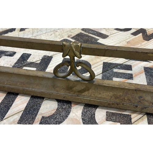 488 - Antique brass fire fender.