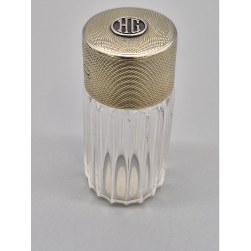 78 - Asprey of London, Silver topped perfume bottle. Has Initial HG to the top section of the lid. Has or... 