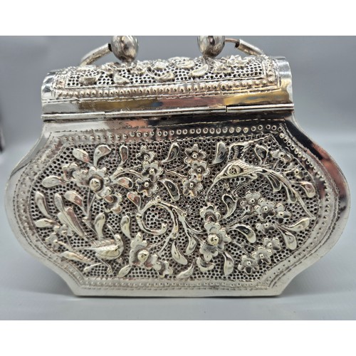 6 - Persian silver plated highly decorated and raised relief clutch bag. [Handle down- 14x18x6cm]