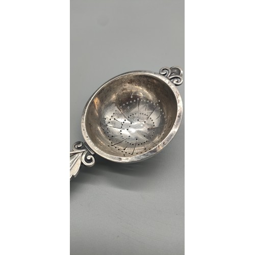 14 - Swedish silver tea strainer. [14.5cm length] [47.64grams]